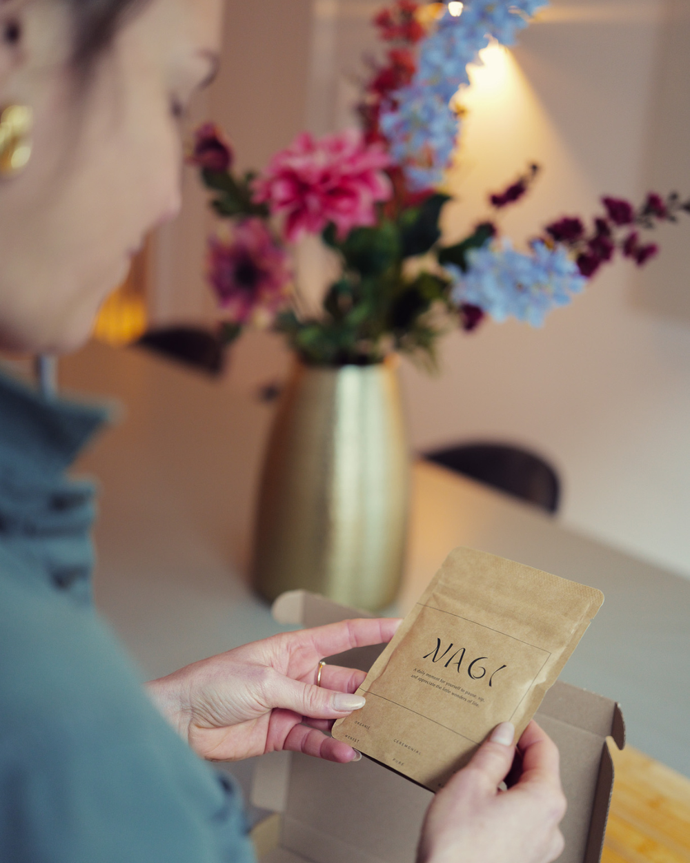 Woman holding Nagi matcha pouch